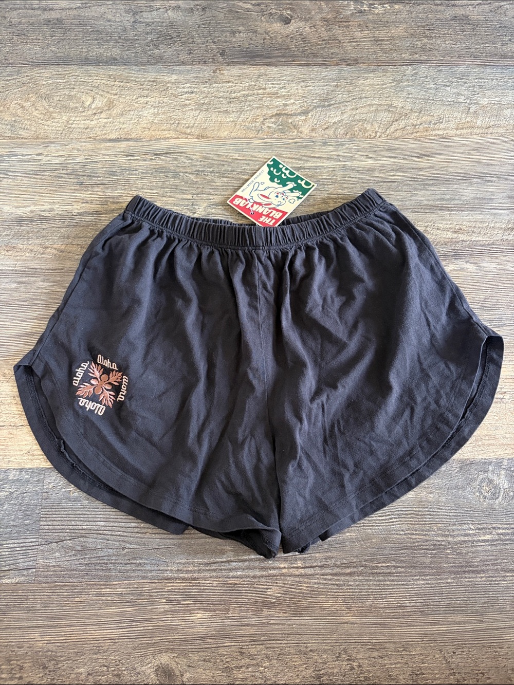 Women’s Black Athletic Shorts with Coral Floral Emblem
